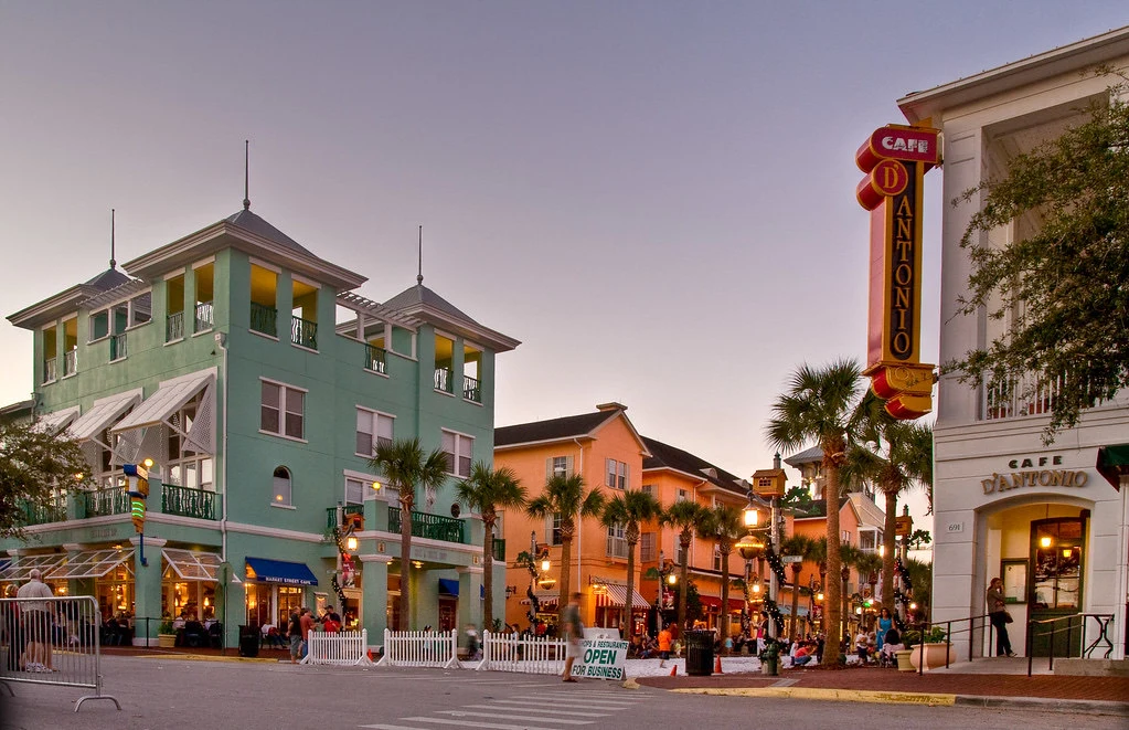 Colorful Celebration streetscape with palm trees, cafes and evening lights