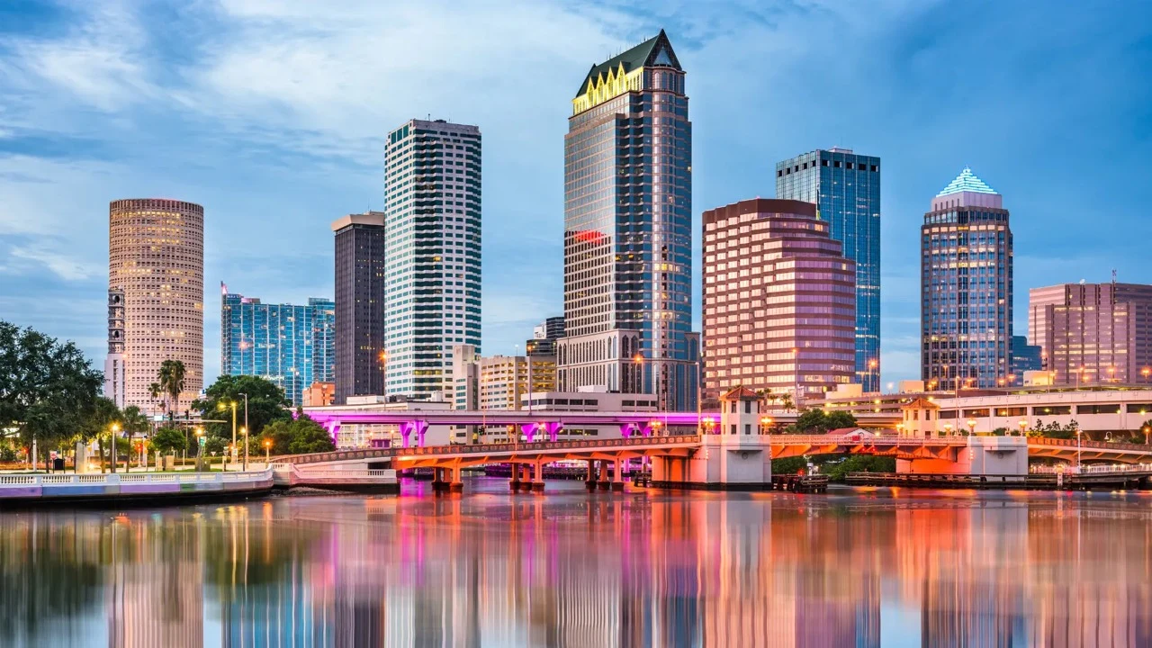 Tampa skyline and illuminated downtown buildings reflected across the waterfront